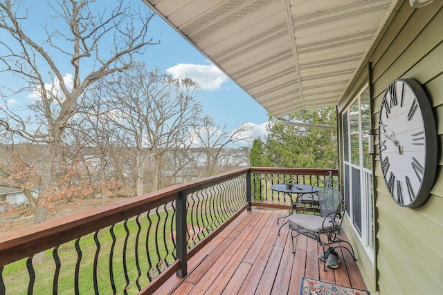 wooden terrace with a yard