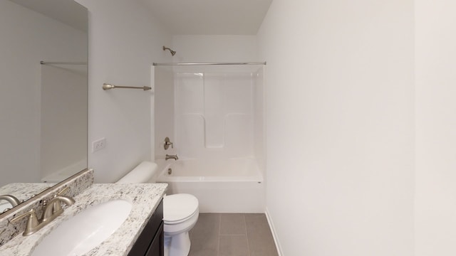 bathroom featuring bathtub / shower combination, vanity, toilet, tile patterned floors, and baseboards