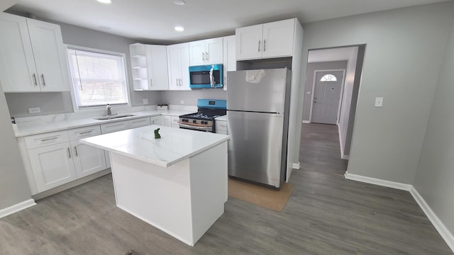 kitchen featuring a sink, white cabinetry, and stainless steel appliances