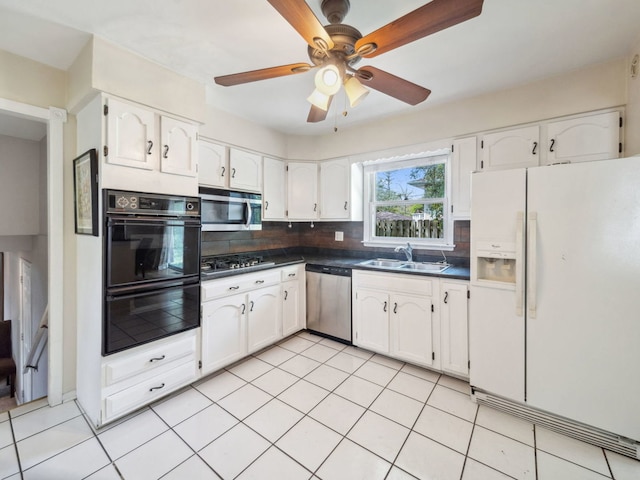 201 41st St, Downers Grove, IL 60515 - kitchen with stainless steel appliances, dark countertops, a sink, and white cabinetry