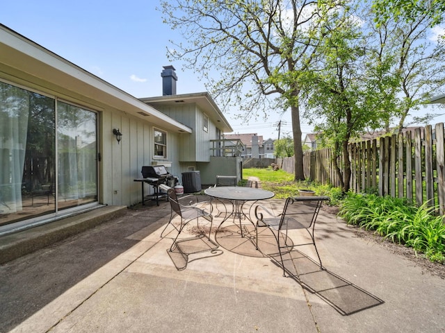 201 41st St, Downers Grove, IL 60515 - view of patio / terrace with central air condition unit, fence, and outdoor dining area