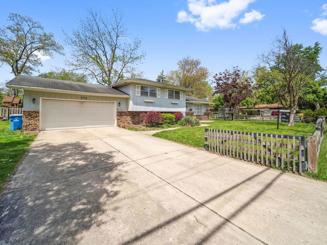 201 41st St, Downers Grove, IL 60515 - split level home featuring concrete driveway and an attached garage