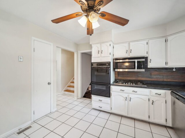 201 41st St, Downers Grove, IL 60515 - kitchen with stainless steel appliances, dark countertops, white cabinets, and ceiling fan