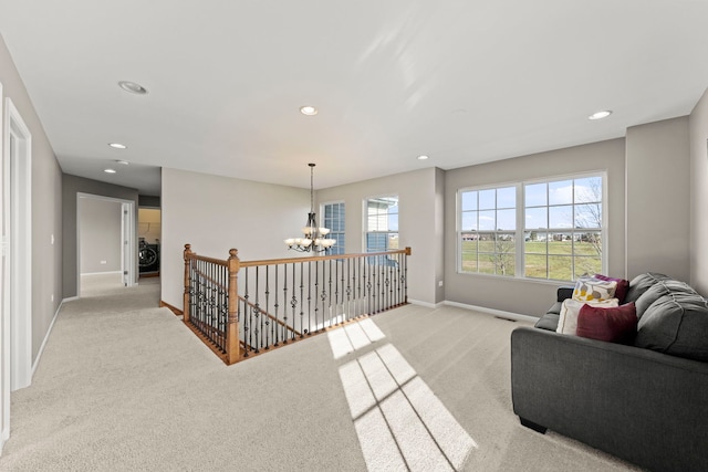 living area featuring light colored carpet, recessed lighting, a chandelier, an upstairs landing, and baseboards