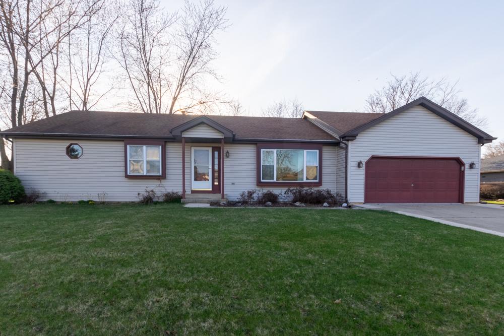 1610 Kenmore Ave, Aurora, IL 60505 - single story home with a front lawn, driveway, an attached garage, and roof with shingles