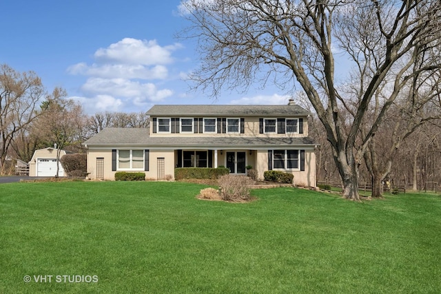 traditional home with a front yard, a garage, and driveway
