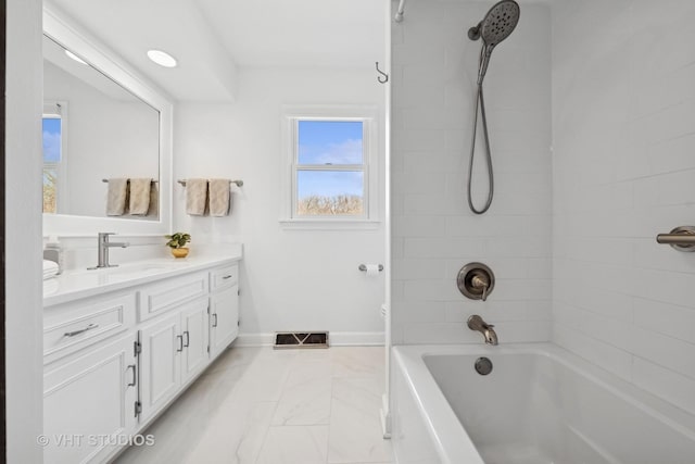 full bath with visible vents, baseboards, tub / shower combination, vanity, and marble finish floor
