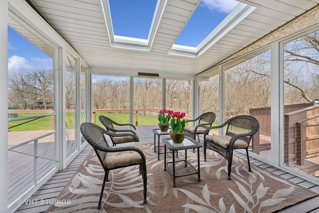 sunroom with a skylight and a healthy amount of sunlight