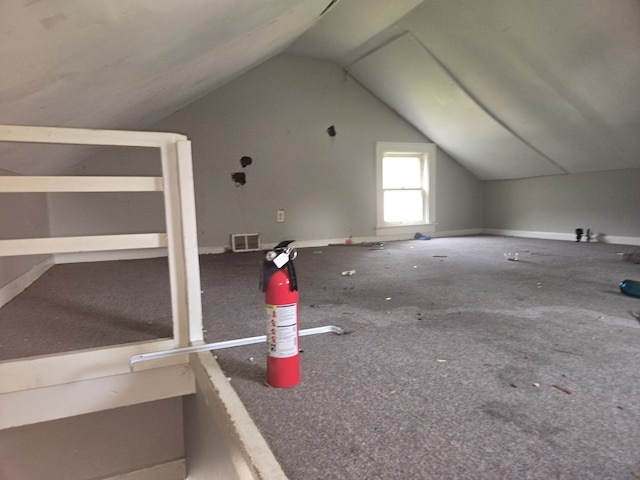 708 W Jefferson St W, Bloomington, IL 61701 - bonus room with vaulted ceiling, carpet floors, and baseboards