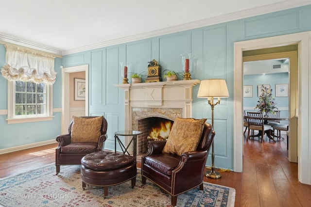 1930 Camphill Cir, Inverness, IL 60067 - sitting room with wood-type flooring, a decorative wall, ornamental molding, and a high end fireplace
