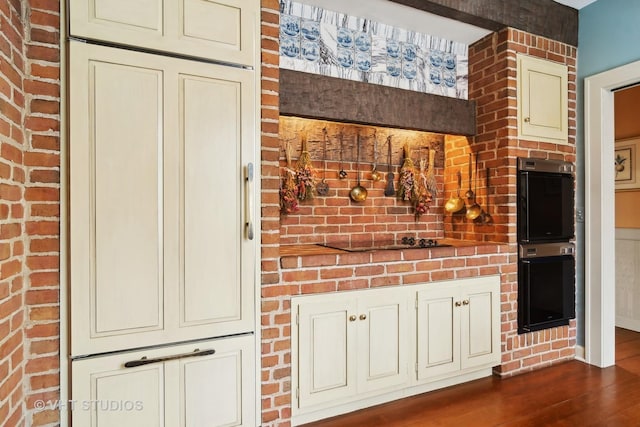 1930 Camphill Cir, Inverness, IL 60067 - interior space featuring dark wood finished floors, black electric cooktop, stainless steel double oven, and cream cabinets