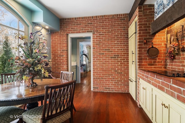 1930 Camphill Cir, Inverness, IL 60067 - dining area with brick wall and dark wood finished floors