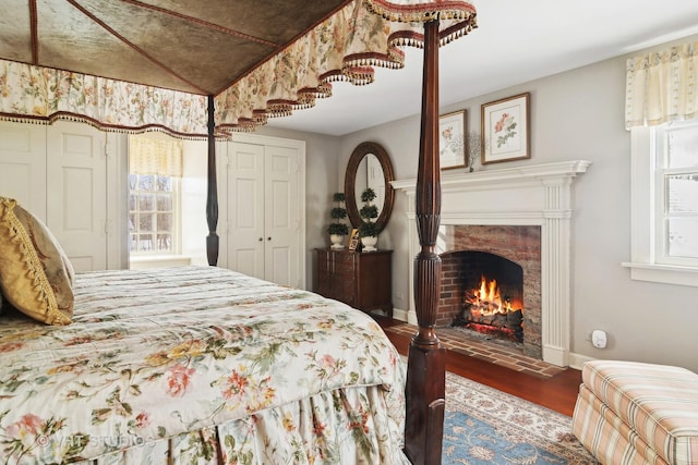 1930 Camphill Cir, Inverness, IL 60067 - bedroom featuring a warm lit fireplace, wood finished floors, and baseboards