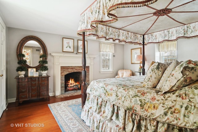 1930 Camphill Cir, Inverness, IL 60067 - bedroom featuring a premium fireplace, baseboards, and wood finished floors