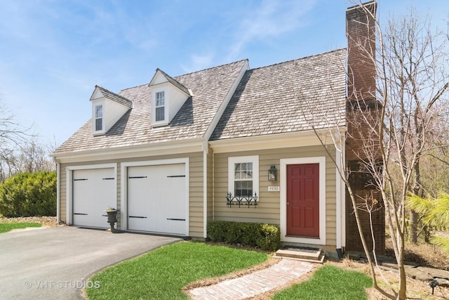 1930 Camphill Cir, Inverness, IL 60067 - cape cod home with an attached garage, driveway, and a chimney