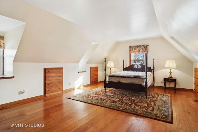 1930 Camphill Cir, Inverness, IL 60067 - bedroom with wood-type flooring, vaulted ceiling, and visible vents