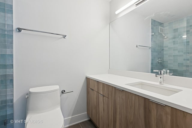 474 N Lake Shore Dr Unit 4105, Chicago, IL 60611 - bathroom with vanity, toilet, a tile shower, and baseboards