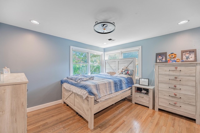 bedroom featuring recessed lighting, baseboards, light wood-style floors, and visible vents