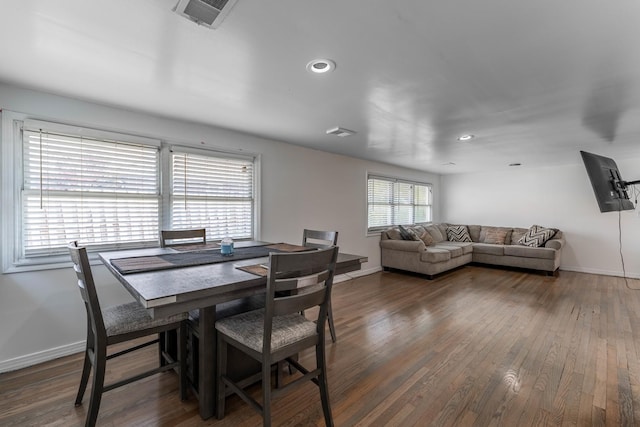 dining space with baseboards, visible vents, recessed lighting, and wood finished floors