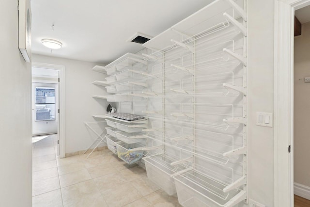walk in closet featuring light tile patterned floors