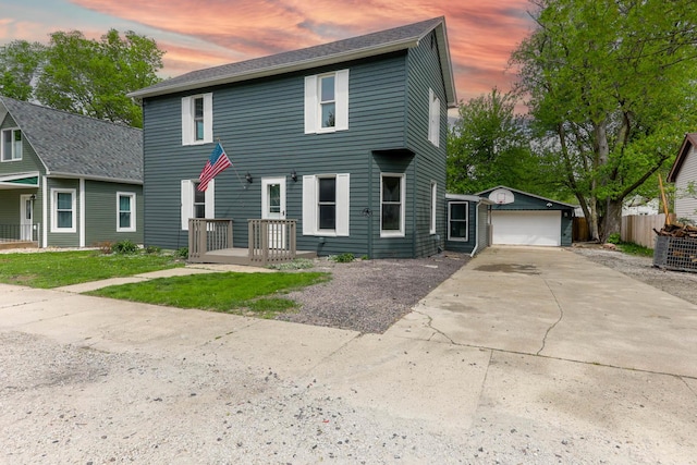 114 W Columbia St, Danvers, IL 61732 - colonial house with a garage, fence, and an outbuilding