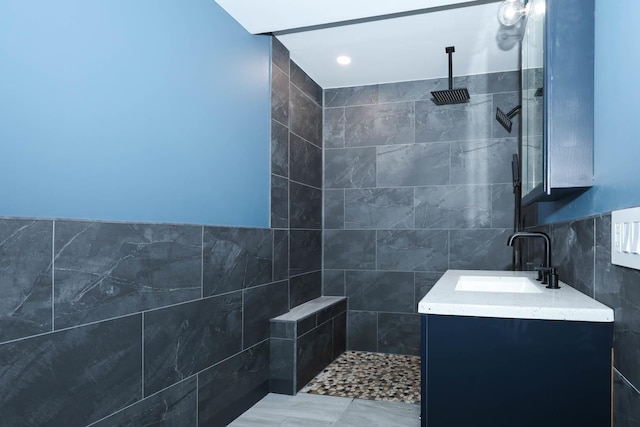 114 W Columbia St, Danvers, IL 61732 - full bathroom featuring vanity, tiled shower, and tile walls