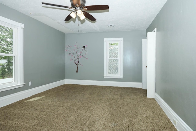 114 W Columbia St, Danvers, IL 61732 - empty room featuring carpet floors, a ceiling fan, and baseboards
