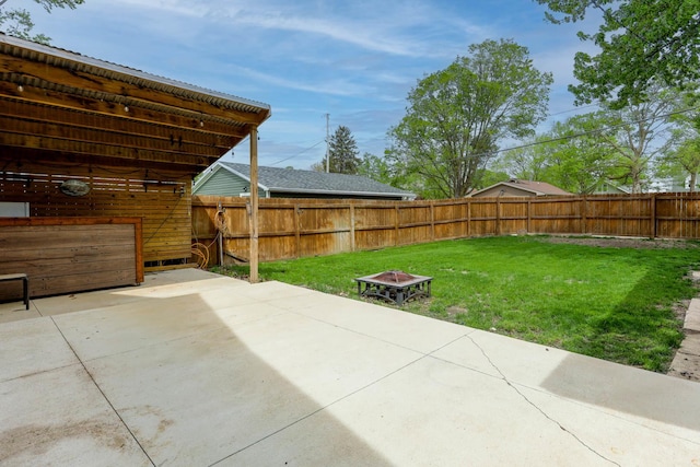 114 W Columbia St, Danvers, IL 61732 - view of patio / terrace with a fenced backyard and an outdoor fire pit