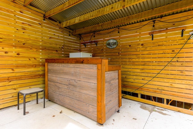 114 W Columbia St, Danvers, IL 61732 - interior space with concrete floors and wooden walls