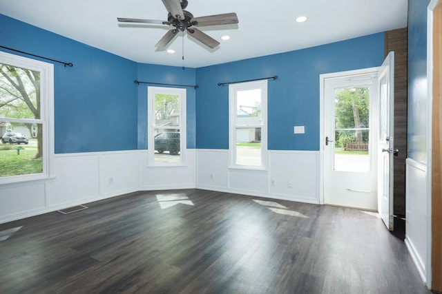 114 W Columbia St, Danvers, IL 61732 - empty room with wainscoting, a ceiling fan, recessed lighting, dark wood-type flooring, and visible vents