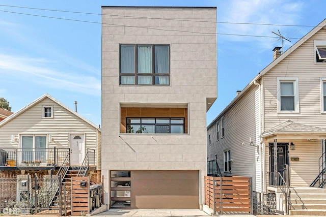 modern home featuring an attached garage and driveway