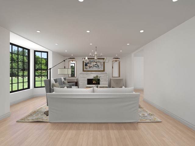 3031 Indianwood Rd, Wilmette, IL 60091 - living room with a warm lit fireplace, light wood-style flooring, recessed lighting, and baseboards
