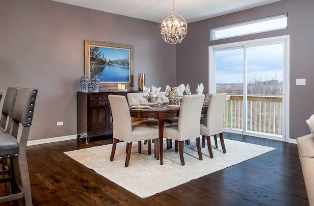 dining area with dark wood-style floors, baseboards, and an inviting chandelier