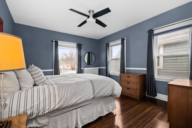 1130 Paulina St, Oak Park, IL 60302 - bedroom featuring radiator, wood finished floors, baseboards, and a ceiling fan