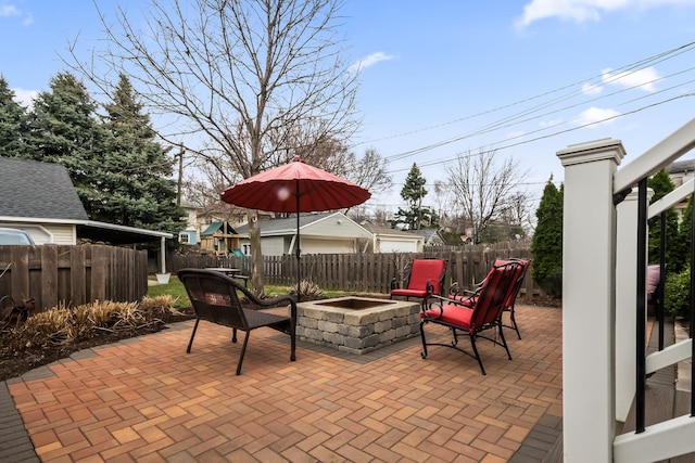 1130 Paulina St, Oak Park, IL 60302 - view of patio / terrace featuring a fire pit and a fenced backyard