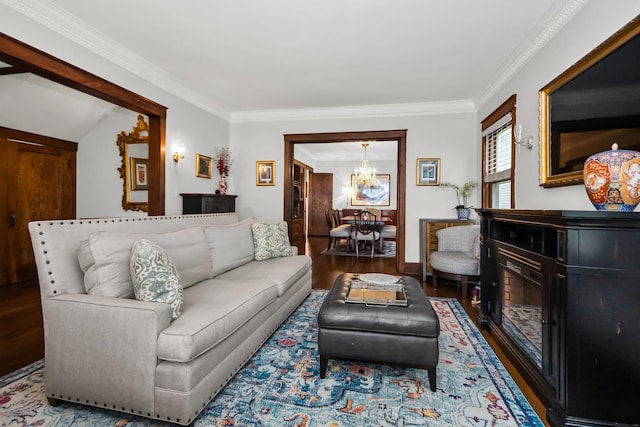 1130 Paulina St, Oak Park, IL 60302 - living area with crown molding, baseboards, an inviting chandelier, and wood finished floors