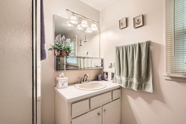 bathroom with decorative backsplash and vanity