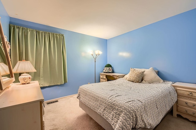 bedroom with carpet flooring and visible vents