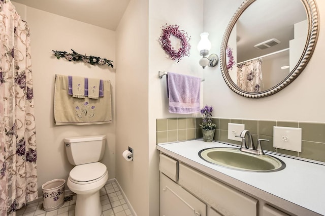 bathroom featuring toilet, vanity, tasteful backsplash, baseboards, and visible vents