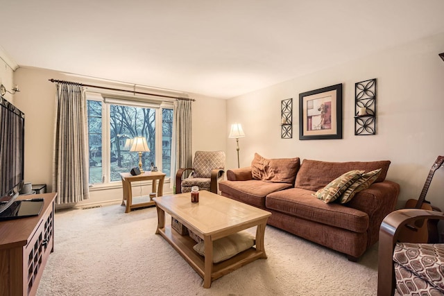 carpeted living area with visible vents
