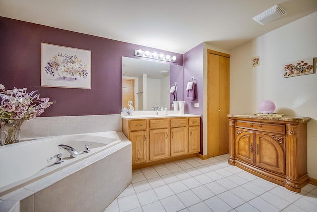11850 Windemere Ct Unit 103, Orland Park, IL 60467 - bathroom with visible vents, tile patterned flooring, vanity, and a garden tub