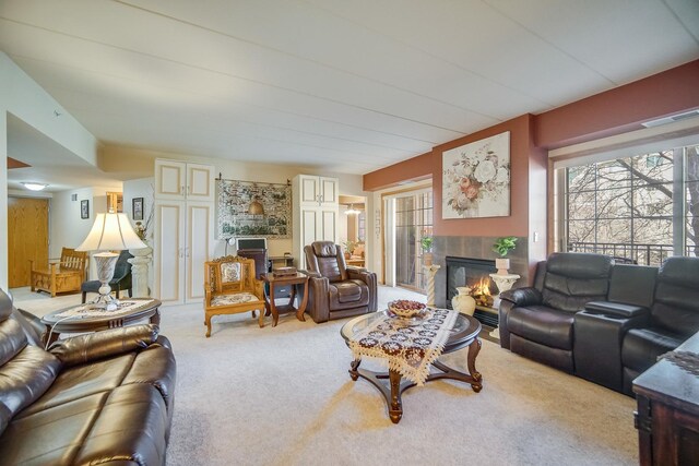 11850 Windemere Ct Unit 103, Orland Park, IL 60467 - carpeted living room with plenty of natural light, a fireplace, and visible vents