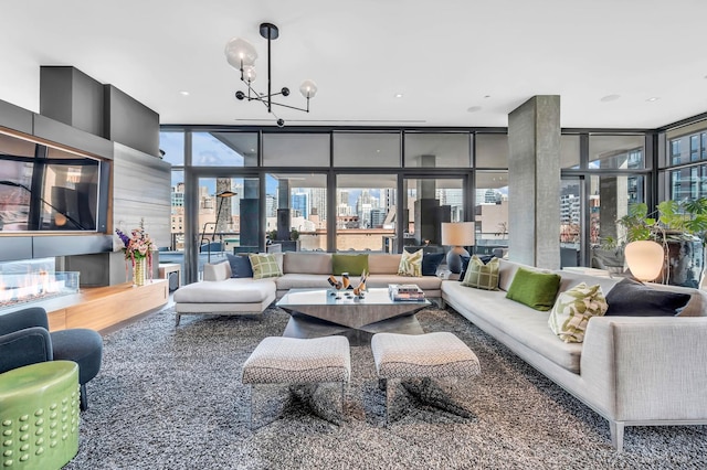 400 W Huron St Unit 501, Chicago, IL 60654 - living area featuring a wall of windows and a chandelier