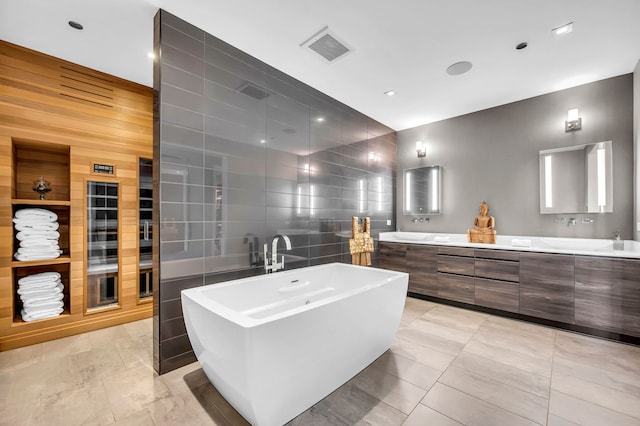 400 W Huron St Unit 501, Chicago, IL 60654 - full bathroom featuring a freestanding bath, double vanity, and tile walls