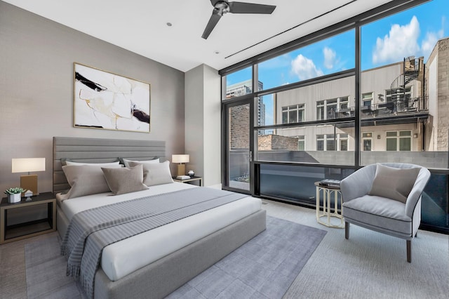 400 W Huron St Unit 501, Chicago, IL 60654 - carpeted bedroom with floor to ceiling windows and ceiling fan