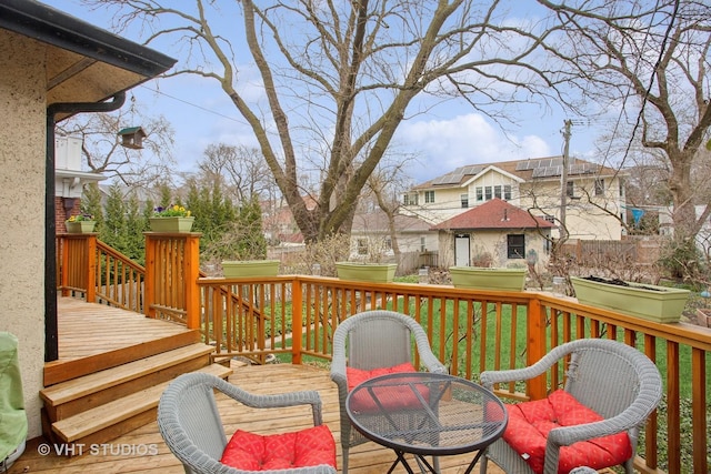 wooden terrace with outdoor dining space