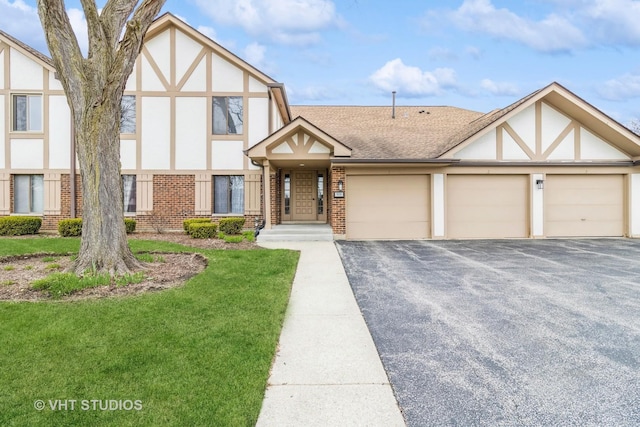 920 Surrey Dr Unit 1A, Schaumburg, IL 60193 - tudor home with driveway, brick siding, an attached garage, a shingled roof, and stucco siding