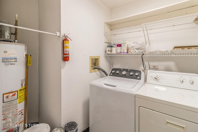 920 Surrey Dr Unit 1A, Schaumburg, IL 60193 - washroom with water heater, washing machine and clothes dryer, and laundry area