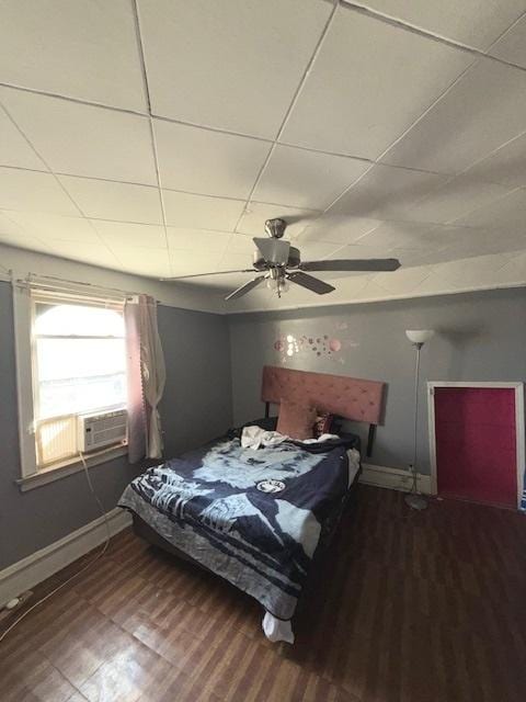 4734 W Monroe St, Chicago, IL 60644 - bedroom with baseboards, cooling unit, a ceiling fan, and wood finished floors