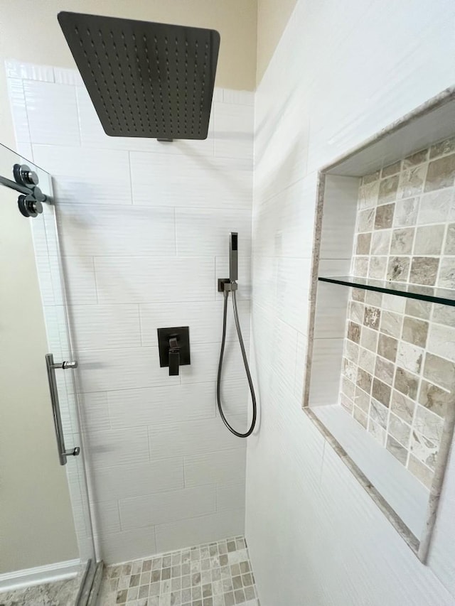 bathroom featuring a shower stall